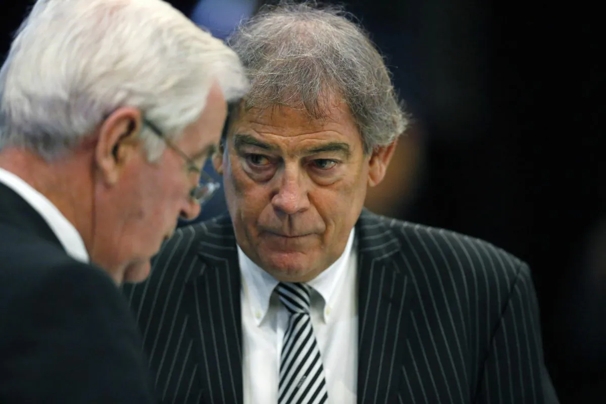New Zealander David Howman (R), the director general of the World Anti-Doping Agency (WADA), talks with Craig Reedie, WADA president, during a break in a meeting at the Broadmoor Hotel in Colorado Springs, Wednesday, Nov. 18, 2015. Leaders from the World Anti-Doping Agency met Wednesday to decide whether to ban Russia's anti-doping operation in the wake of the report about corruption in the country's track and anti-doping programs. (AP Photo/Brennan Linsley)