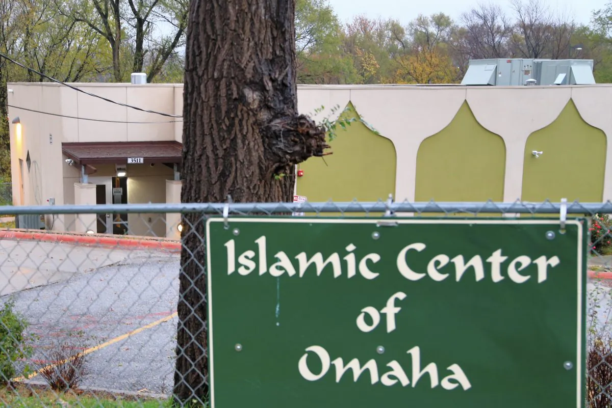 Graffiti in the shape of the Eiffel Tower inside a circle is painted on the left side of the Islamic Center in Omaha, Neb., Tuesday, Nov. 17, 2015. (AP Photo/Nati Harnik)