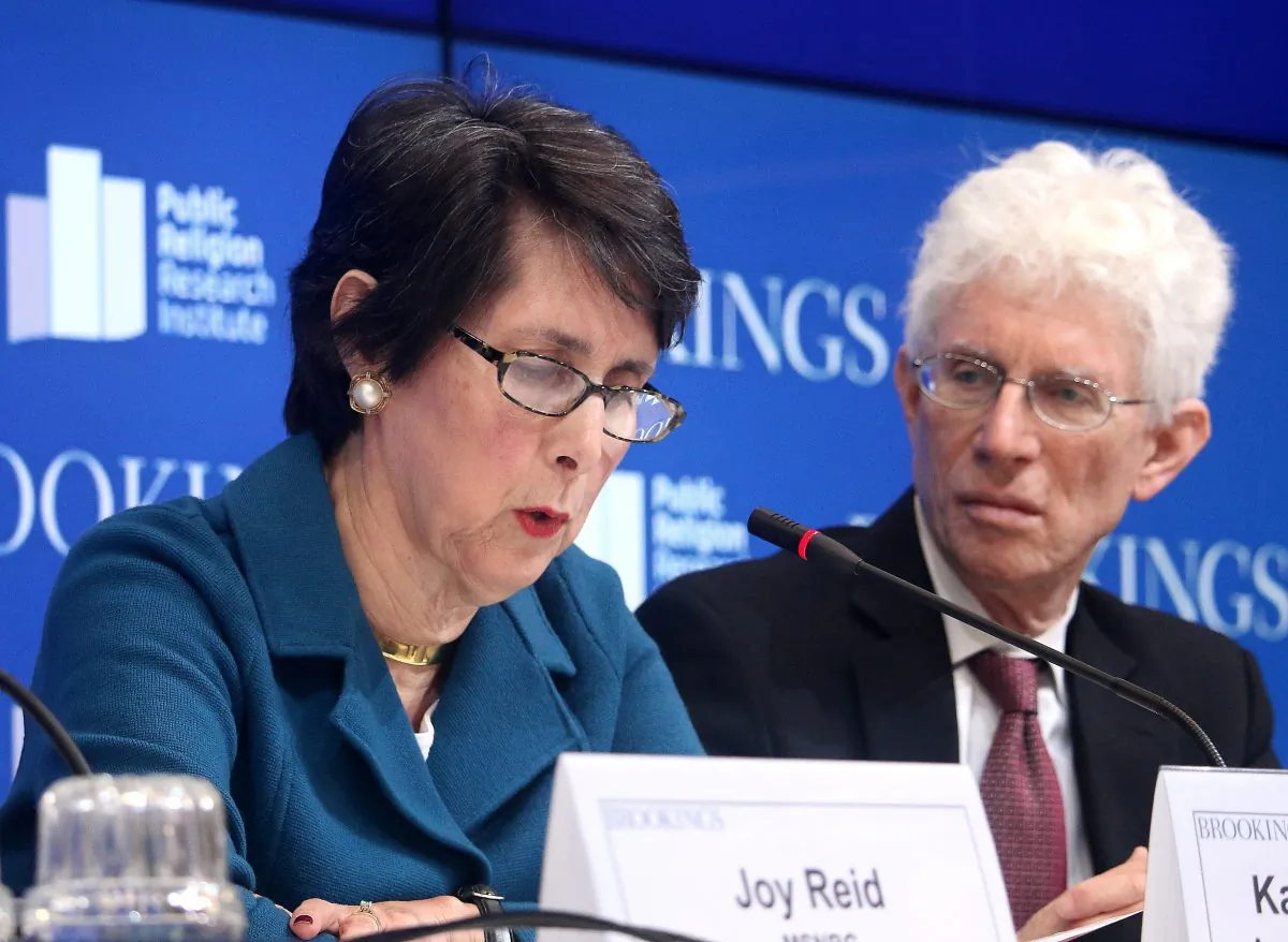 Karlyn Bowman, senior fellow and research coordinator at the American Enterprise Institute, speaks on the findings from 2015 American Values Survey, as William Galston, senior fellow at The Brookings Institution, looks on. The event took place at Brookings on Nov. 17. (Gary Feuerberg/Epoch Times)