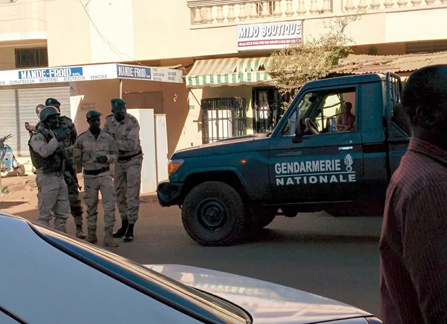 In this image made available by Malikahere.com security personnel, attend close to the scene of an attack on a hotel in Bamako, Mali Friday Nov. 20, 2015. (Malikahere.com via AP)