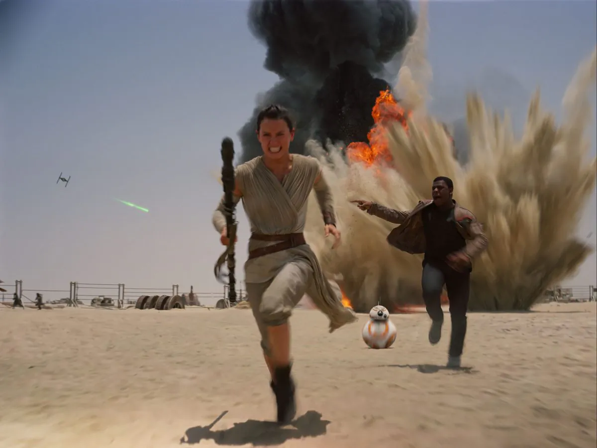 This photo provided by Disney shows Daisey Ridley as Rey (L) and John Boyega as Finn, in a scene from the new film, "Star Wars: Episode VII—The Force Awakens," directed by J.J. Abrams. (Film Frame/Disney-Lucasfilm via AP)