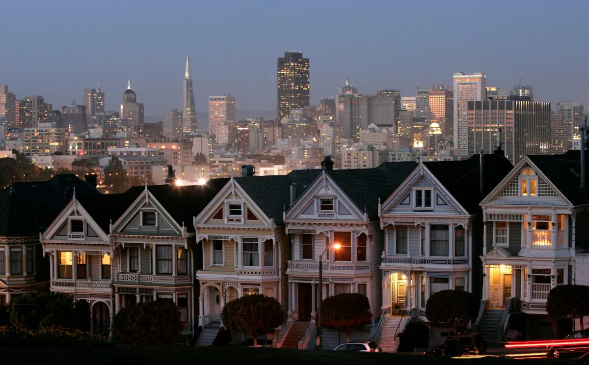 The "Painted Ladies," a row of historical Victorian homes, underscore the San Francisco skyline in a view from Alamo Square. (AP Photo/Marcio Jose Sanchez)