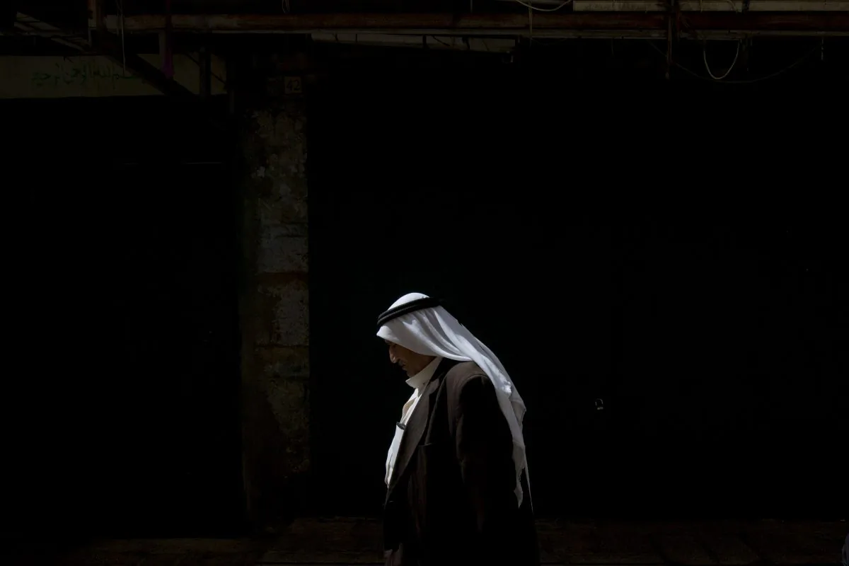 A Palestinian man walks in the Old City in Jerusalem, on Oct. 8, 2015. (AP Photo/Sebastian Scheiner)