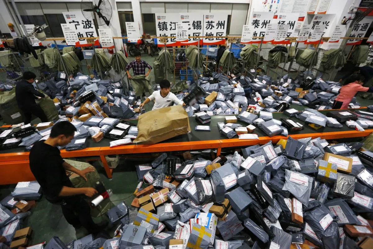 An mail crew deals with express packages at an assembly line on Nov. 12, 2014 in Wenzhou, Zhejiang, during Singles Day. (ChinaFotoPress/ChinaFotoPress via Getty Images)