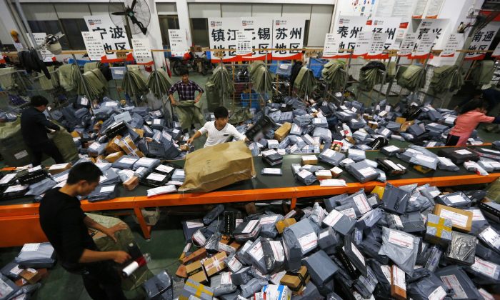An mail crew deals with express packages at an assembly line on Nov. 12, 2014 in Wenzhou, Zhejiang, during Singles Day. (ChinaFotoPress/ChinaFotoPress via Getty Images)