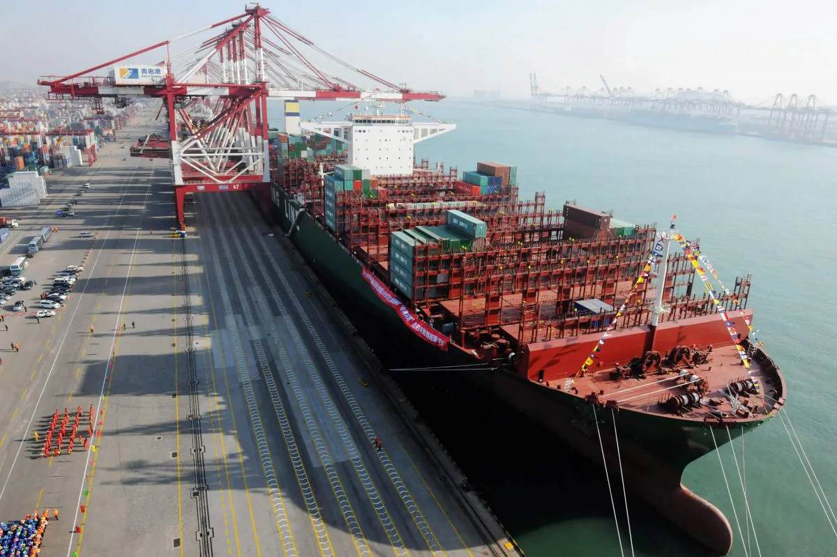 The world’s largest container ship, “CSCL Globe,” docks at Port of Qingdao on Dec. 12, 2014 in Qingdao, Shandong Province, China. China Shipping Group Co., which owns CSCL, is in talks to merge with China Ocean Shipping Co. to potentially create the world’s fourth-largest shipping company. (ChinaFotoPress/ChinaFotoPress via Getty Images)