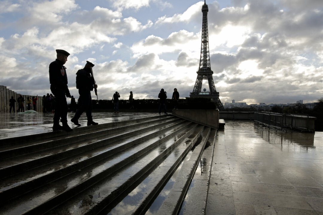 French soldiers patrol the Trocadero place near the Eiffel Tower, in Paris, on Nov. 21, 2015. (AP Photo/Laurent Cipriani)