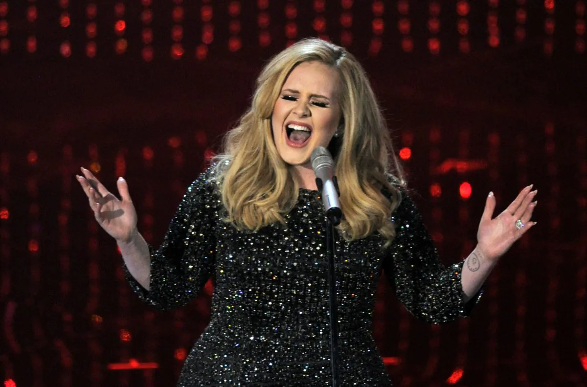 Singer Adele performs during the Oscars at the Dolby Theatre on Sunday Feb. 24, 2013, in Los Angeles.  (Photo by Chris Pizzello/Invision/AP)
