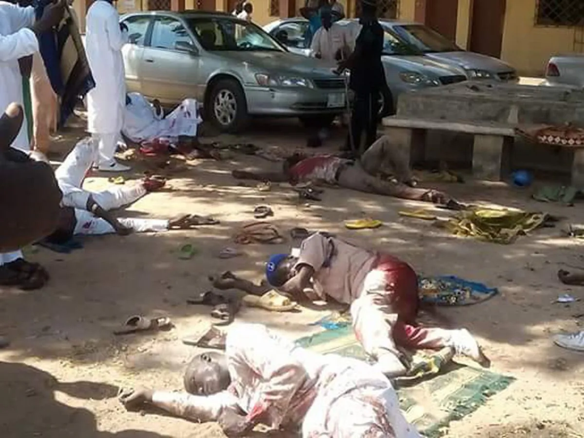 Bodies lies on the ground following a bomb explosion in Yola, Nigeria, Friday, Oct. 23, 2015. (AP Photo/Ibrahim Abdulaziz)
