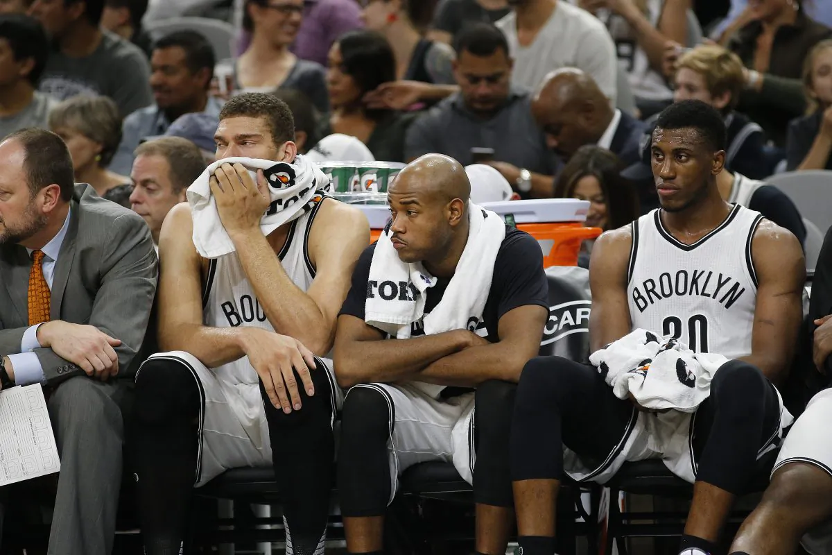 Brook Lopez (L), Jarrett Jack (C), and Thaddeus Young of the Brooklyn Nets have lost 11 of their first 14 games this season. (Chris Covatta/Getty Images)