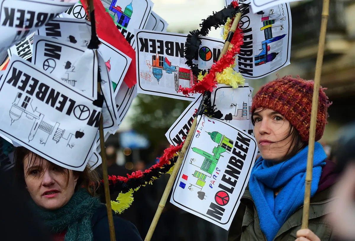 People attend a candle light vigil to the victims of the Paris attacks in Brussels' Molenbeek District's town square, on Nov. 18, 2015. Molenbeek has come under growing scrutiny as a hotbed of Islamic radicalism in Europe, with several major attacks and plots linked to the down-at-heel district, including the Nov. 13 series of shootings and suicide bombings in the French capital Paris in which at least 129 people were killed and hundreds injured. (Emmanuel Dunand/AFP/Getty Images)