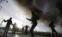 2 Palestinians Die in Clashes; Israel Toughens Fence