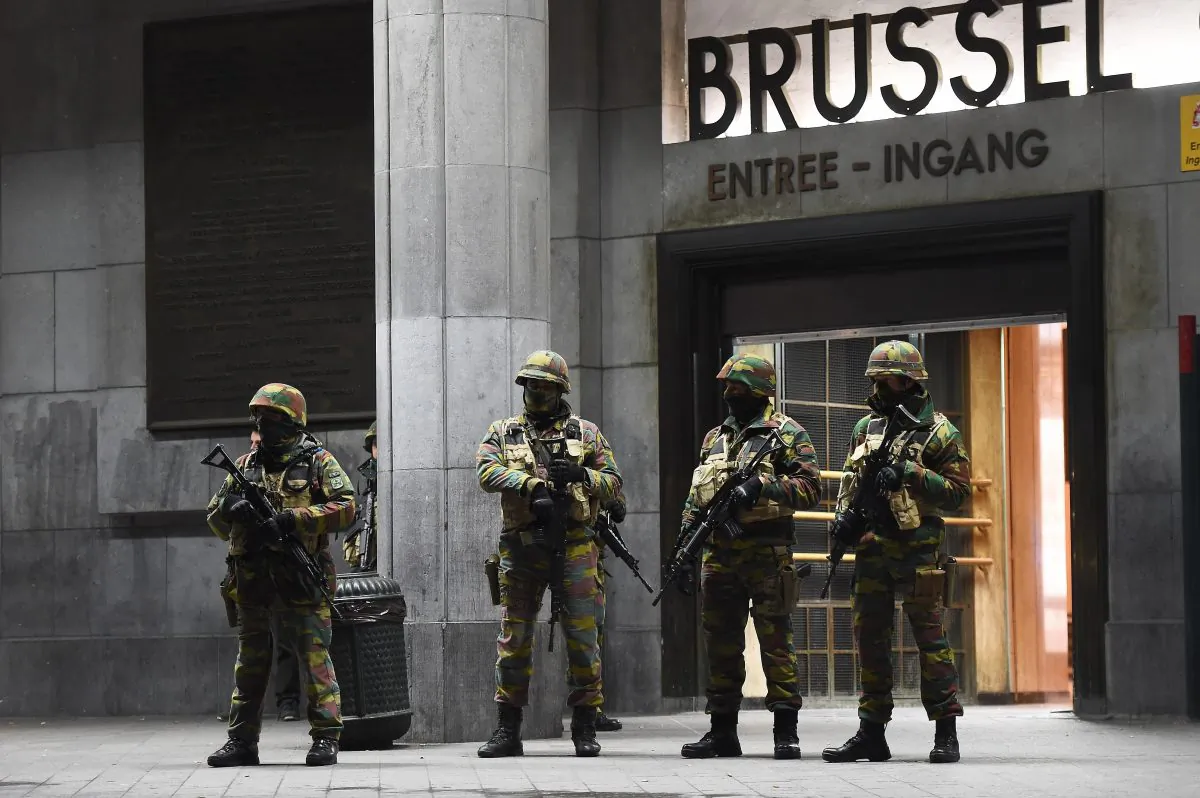 Soldiers stand guard in front of the central train station on Nov. 22, 2015, in Brussels, as the Belgian capital remained on the highest security alert level over fears of a Paris-style attack. (Emmanuel Dunand/AFP Photo)