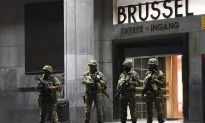 Belgium Police Arrest 21, Paris Fugitive Still at Large