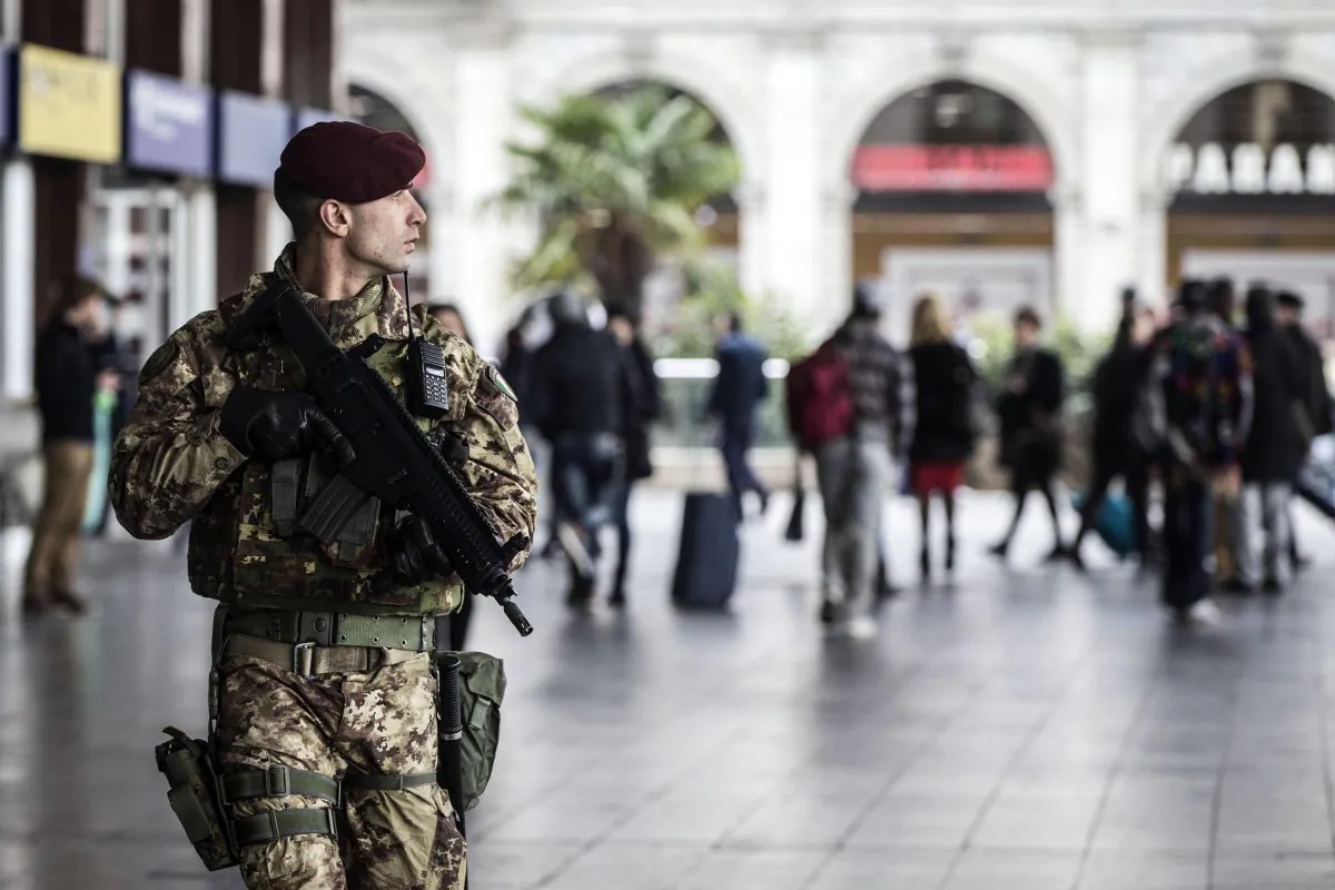 A soldier patrols outside Rome's Termini main train station, Monday, Nov. 23, 2015. Italy and the Vatican beefed up security with some 700 soldiers deployed following the Paris attacks and before Pope Francis' big Jubilee Year starting Dec. 8. (Angelo Carconi/ANSA via AP)