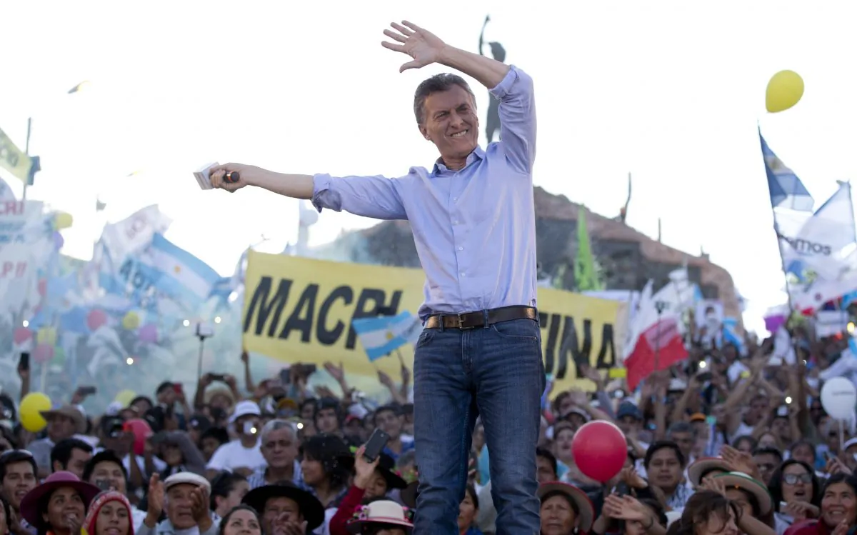 In this Thursday, Nov. 19, 2015 photo, opposition presidential candidate Mauricio Macri waves to supporters during the closing campaign rally in Humahuaca, Jujuy, Argentina. (AP Photo/Natacha Pisarenko)