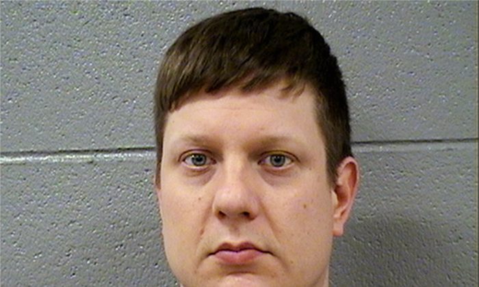 This Tuesday, Nov. 24, 2015 photo released by the Cook County Sheriff's Office shows Chicago police Officer Jason Van Dyke, who was charged Tuesday with first degree murder in the killing of 17-year-old Laquan McDonald on Oct. 20, 2014. (Cook County Sheriff's Office via AP)