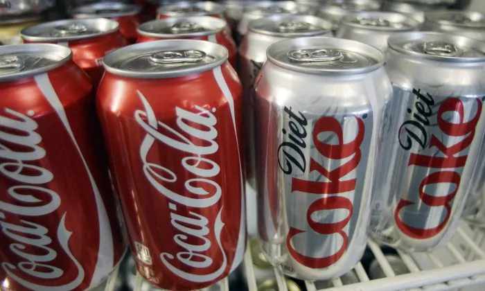 Cans of Coca-Cola and Diet Coke sit in a cooler in Anne's Deli in Portland, Ore., on March 17, 2011. (AP Photo)