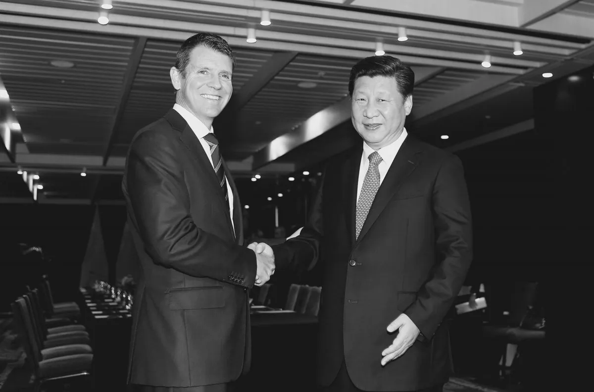 Chinese Communist Party leader  Xi Jinping of China (R) shakes hands with New South Wales Premier Mike Baird on Nov. 19, 2014 in Sydney, Australia.  Australian security experts and officials are concerned about Communist China gaining control of NSW’s power grid. (Daniel Munoz - Pool/Getty Images)