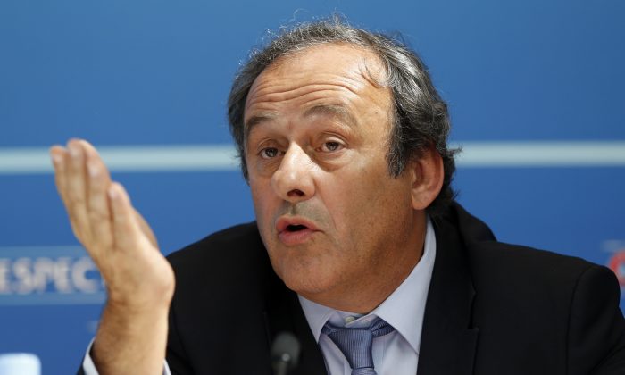 UEFA chief Michel Platini gestures as he speaks during a UEFA press conference after the draw for the UEFA Europa League football group stage 2015/16 in Monaco, on Aug. 28. (VALERY HACHE/AFP/Getty Images)