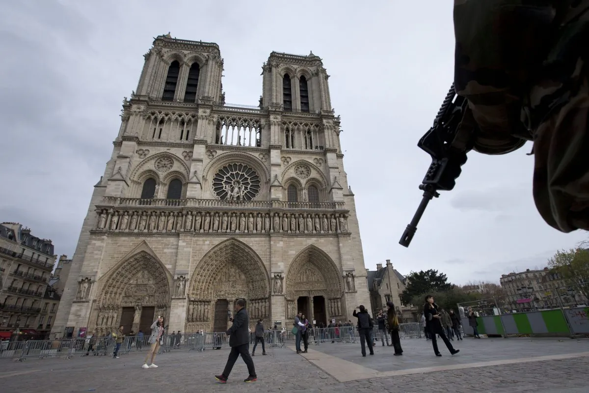 A soldier patrols the Notre Dame Cathedral in Paris on Nov. 16. (Peter Dejong/AP Photo)