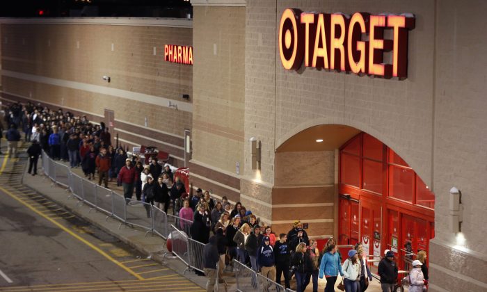 Shoppers head into Target just after their doors opened at midnight on Black Friday in South Portland, Maine, on Nov. 28, 2014. (AP Photo/Robert F. Bukaty)