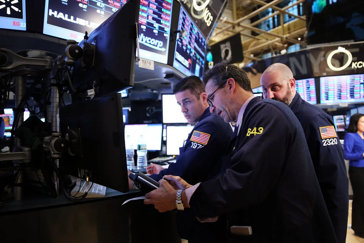 Traders work on the floor of the New York Stock Exchange at the end of the trading day in New York City on Feb. 3, 2014. The global economy is facing new threats it is unable to defend against. (Spencer Platt/Getty Images)