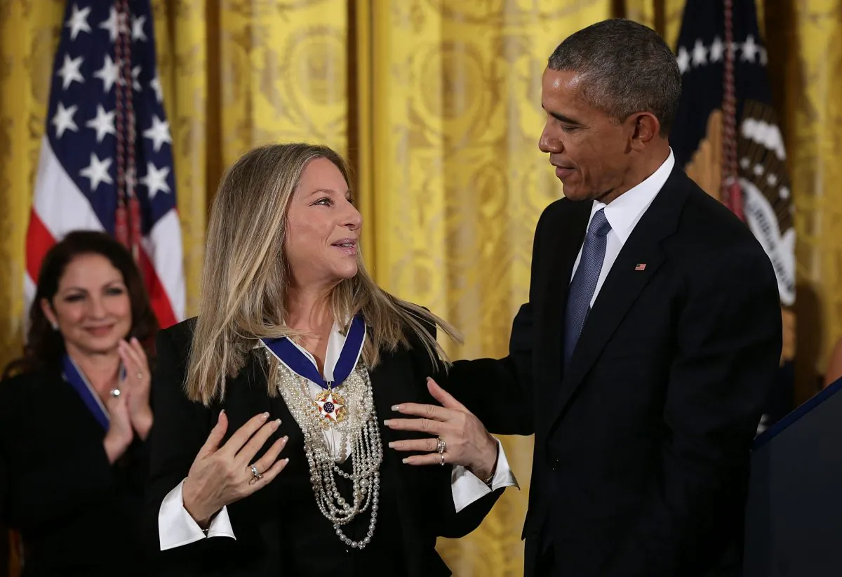 WASHINGTON, DC - NOVEMBER 24: U.S. President Barack Obama (R) presents the Presidential Medal of Freedom to singer Barbra Streisand (L) during an East Room ceremony November 24, 2015 at the White House in Washington, DC. Seventeen recipients were awarded with the nationÕs highest civilian honor. (Photo by Alex Wong/Getty Images)