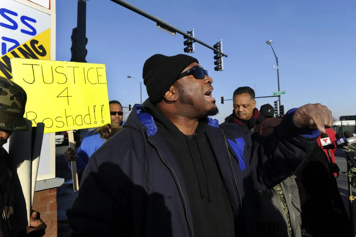 Fred Hampton Jr. argues with a television reporter during a vigil for 17-year-old Laquan McDonald, who was fatally shot and killed Oct. 20, 2014 in Chicago. (AP Photo/Paul Beaty)