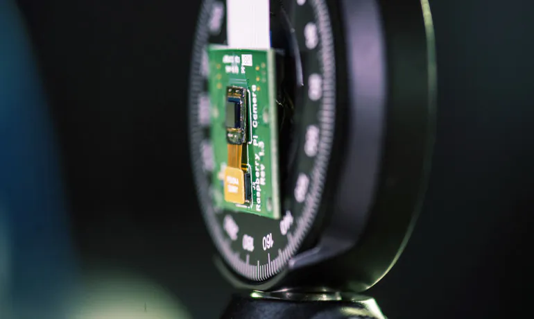 "Moving from a cube design to just a surface without sacrificing performance opens up so many possibilities," says Richard Baraniuk. "We can make curved cameras, or wallpaper that's actually a camera. You can have a camera on your credit card or a camera in an ultrathin tablet computer." (Credit: Jeff Fitlow/Rice)