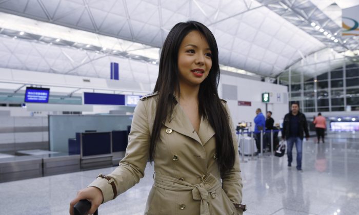 Canada's Miss World contestant Anastasia Lin speaks to media after she was denied entry to mainland China, at Hong Kong International Airport in Hong Kong on Nov. 26, 2015. (AP Photo/Kin Cheung)