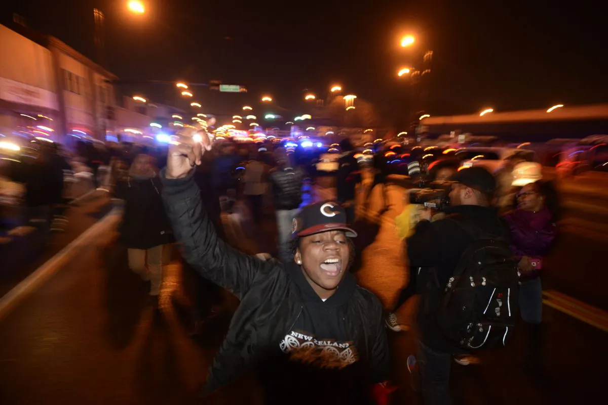 Protesters march during a demonstration, Tuesday, Nov. 24, 2015, for 17-year-old Laquan McDonald, who was fatally shot and killed in October 2014, in Chicago. (AP Photo/Paul Beaty)