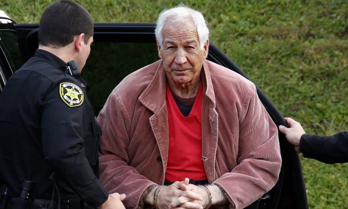 In this Oct. 29, 2015, file photo, former Penn State University assistant football coach Jerry Sandusky arrives at the Centre County Courthouse for an appeal hearing in Bellefonte, Pa.  (AP Photo/Gene J. Puskar, File)