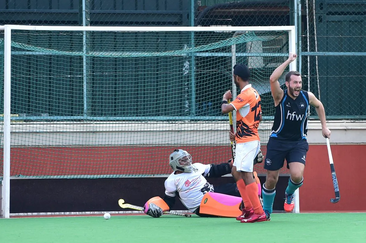 Tom Moore of HKFC-A celebrates scoring the opening goal against SSSC-A in the HKHA premier division at the Hong Kong Football Club ground on Sunday Nov 22, 2015. (Cox/Epoch Times)