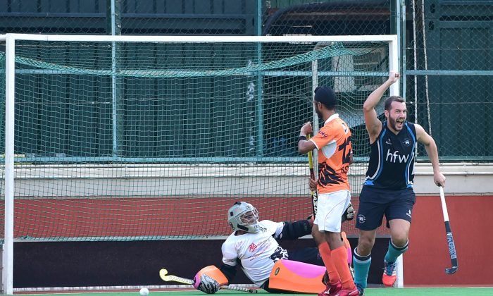 Tom Moore of HKFC-A celebrates scoring the opening goal against SSSC-A in the HKHA premier division at the Hong Kong Football Club ground on Sunday Nov 22, 2015. (Cox/Epoch Times)