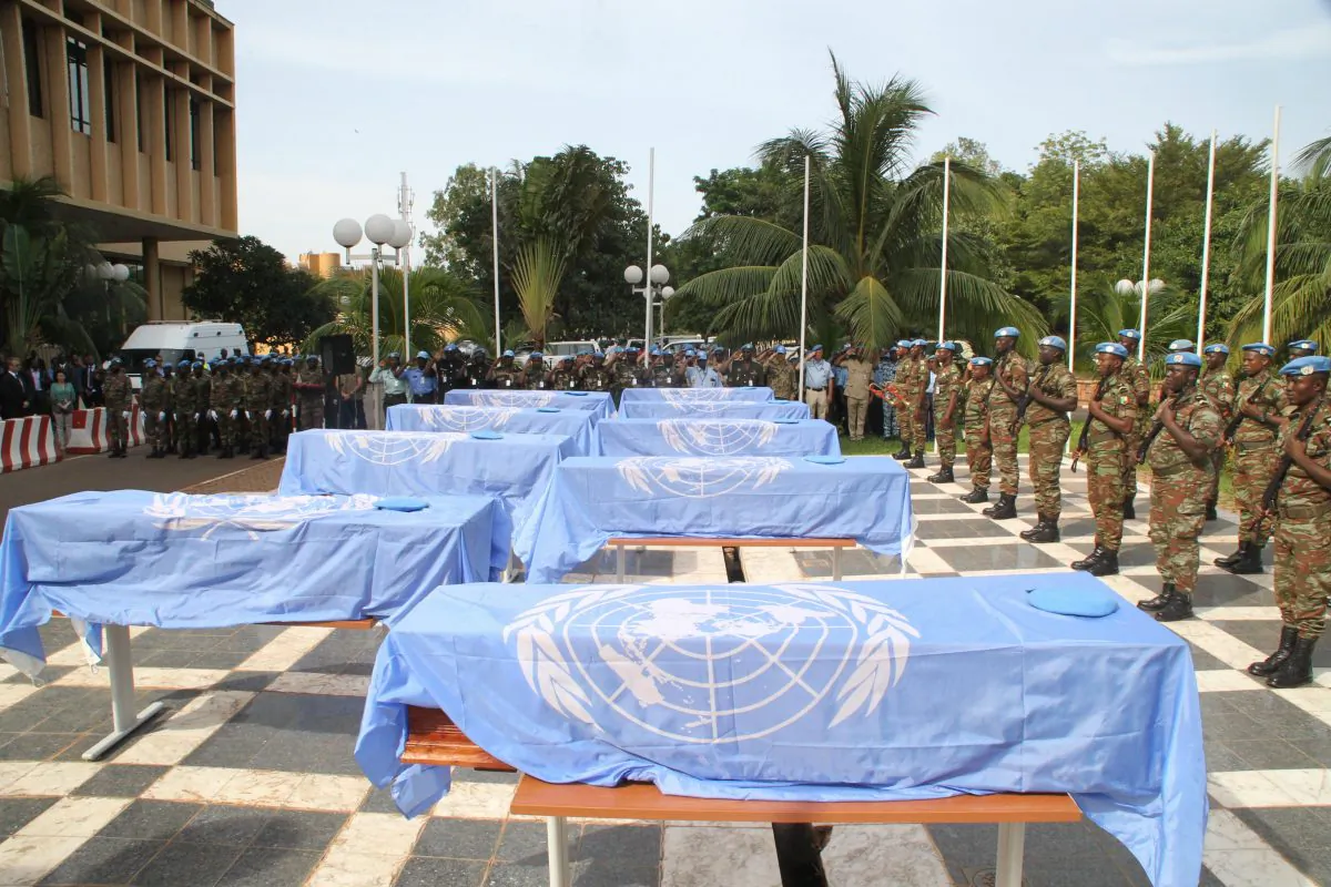 The coffins of nine UN soldiers are draped with U.N. flags during a service at the headquarters of MINUSMA, the U.N. mission in Mali on Oct. 7, 2014, in Bamako. The soldiers, all from Niger, were on a supply run in the north-eastern desert on Oct. 3, when they were targeted by armed men on motorbikes. (Habibou Kouyate/AFP/Getty Images)