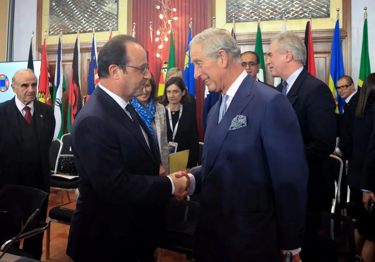 French President Francois Hollande (L) is greeted by Prince Charles, Prince of Wales at a Special Executive Session on Climate Action being held at the Radisson Blu Resort and Spa, Malta Golden Sands Hotel on Nov. 27, 2015, near Valletta, Malta. (Matt Cardy/Getty Images)