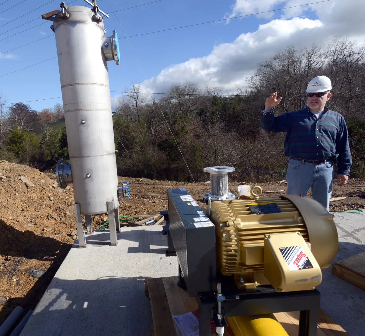 Tom Hecmanczuk, Ingenco's director of construction, talks about the process of converting the Bristol Virginia Landfill methane gas into electricity, on Nov. 19, 2015. (David Crigger/Bristol Herald-Courier via AP)