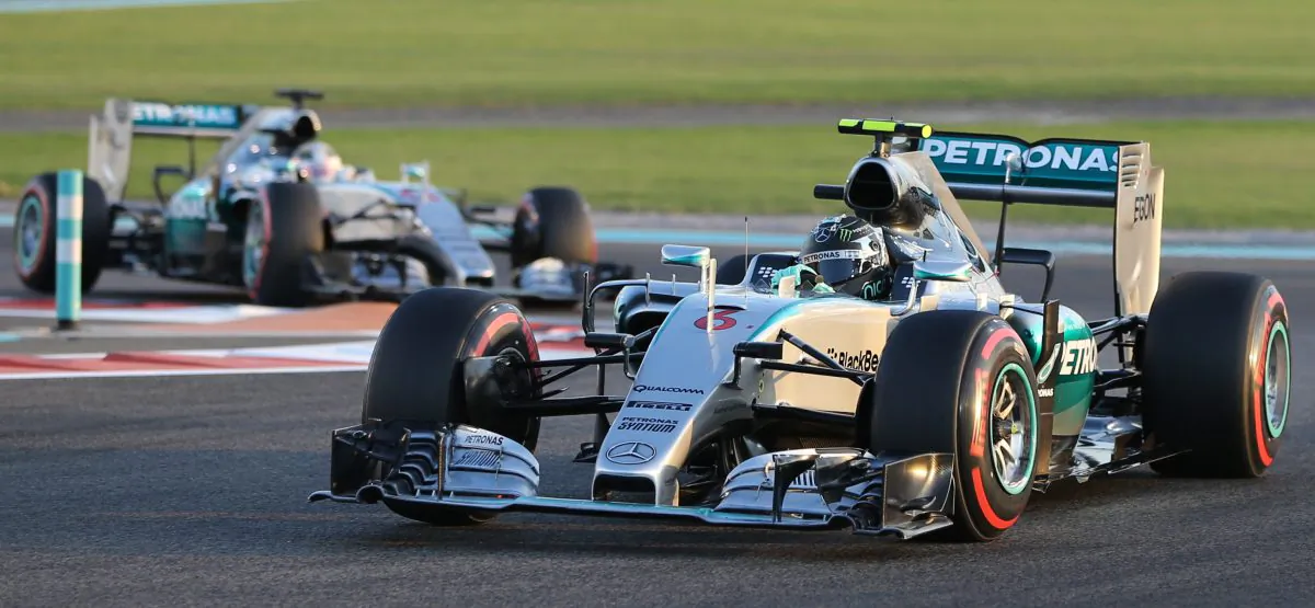Mercedes driver Nico Rosberg of Germany steers his car in front of his team driver Lewis Hamilton of Britain during the Emirates Formula One Grand Prix at the Yas Marina racetrack in Abu Dhabi, United Arab Emirates, Sunday, Nov. 29, 2015. (AP Photo/Kamran Jebreili)
