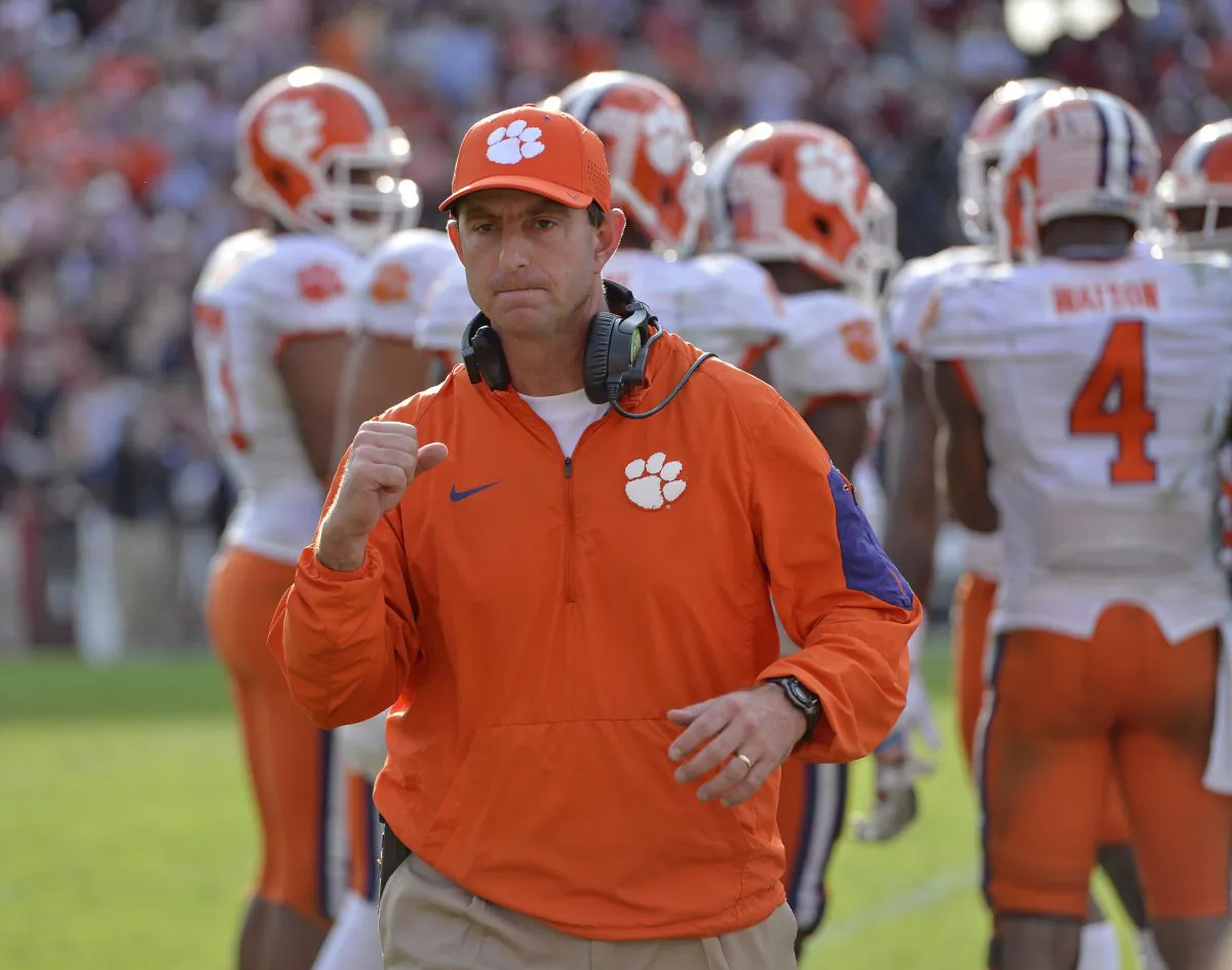 Clemson head coach Dabo Swinney reacts in the closing minutes of an NCAA college football game against South Carolina Saturday,  Nov. 28, 2015,  in Columbia,  S.C. Clemson won 37-32. (AP Photo/Richard Shiro)