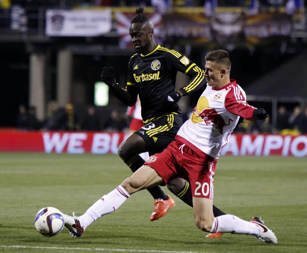 New York Red Bulls defender Matt Miazga, right, works for the ball against Columbus Crew forward Kei Kamara during the first half in the first leg of the MLS soccer Eastern Conference championship in Columbus, Ohio, Sunday, Nov. 22, 2015. (AP Photo/Paul Vernon)