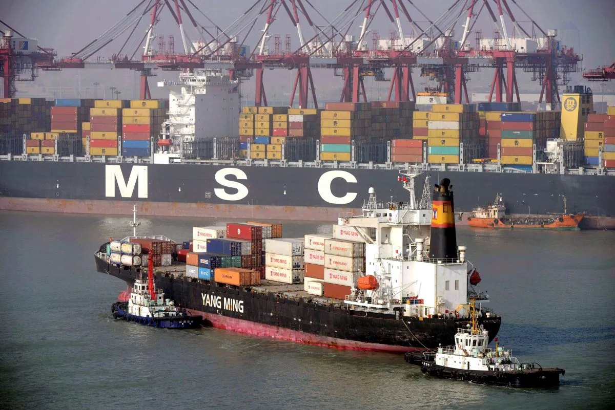 A container ship arrives at the port of Qingdao, in northeast China's Liaoning province on Jan. 20, 2014. Baltic Dry Index that measures cost of hiring ships rose nearly 50 percent in November. (STR/AFP/Getty Images)