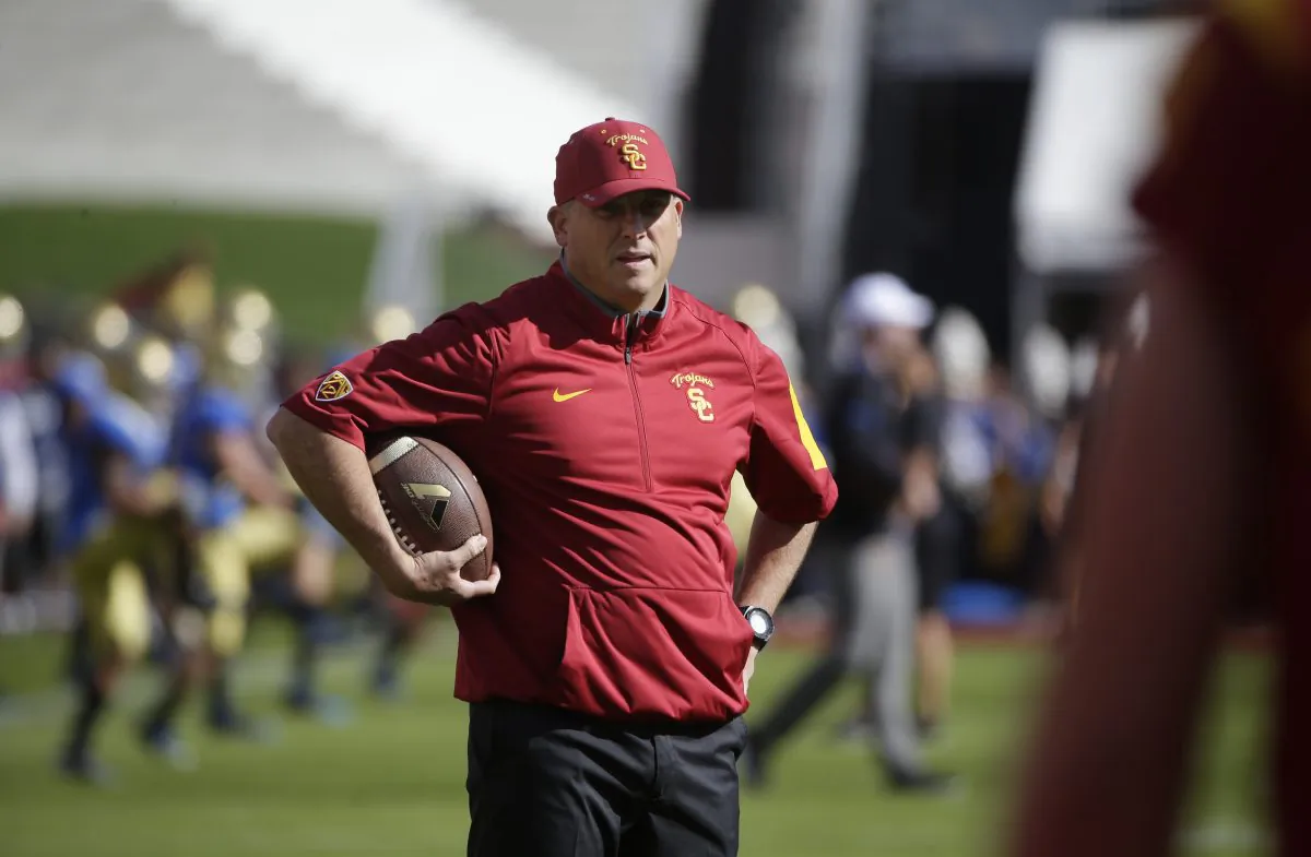 Southern California interim head coach Clay Helton watches his players during practice for an NCAA college football game against UCLA, Saturday, Nov. 28, 2015, in Los Angeles. (AP Photo/Jae C. Hong)