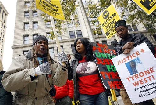 Protestors gather outside Clarence M. Mitchell Jr. Courthouse, Monday, Nov. 30, 2015. (AP Photo/Patrick Semansky)