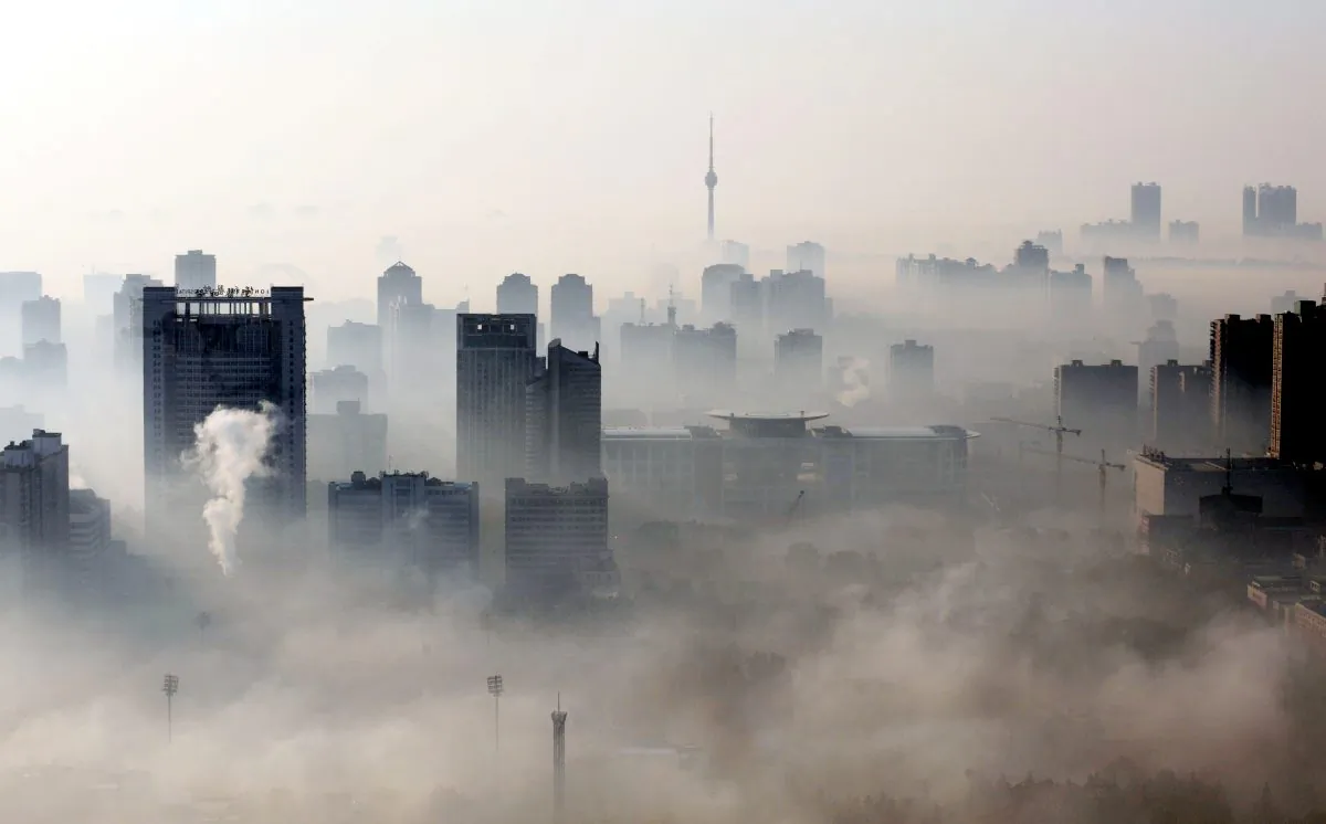 Buildings stand out amid a dense smog engulfing Wuhan, Hubei Province, China, on Dec. 3, 2009. (STR/AFP/Getty Images)
