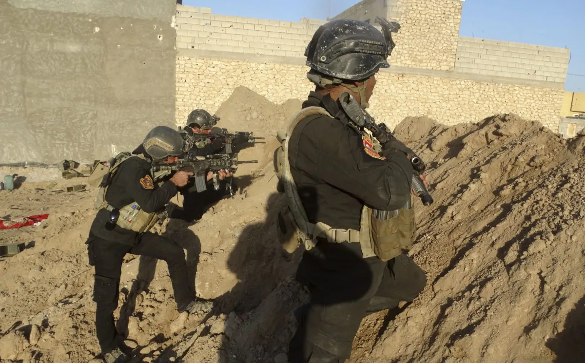 Iraqi security forces take combat position at the front-line with Islamic State group militants as Iraqi Army and allied Sunni volunteer tribal fighters supported by U.S.-led coalition airstrikes are tightened the siege of Ramadi, the capital of Iraq's Anbar province, 70 miles (115 kilometers) west of Baghdad, Iraq, Monday, Nov. 30, 2015. Iraq's military command has told civilians in the Islamic State-held Ramadi to leave the city, a sign that an operation may soon be underway to retake the provincial capital. (AP Photo/Osama Sami)