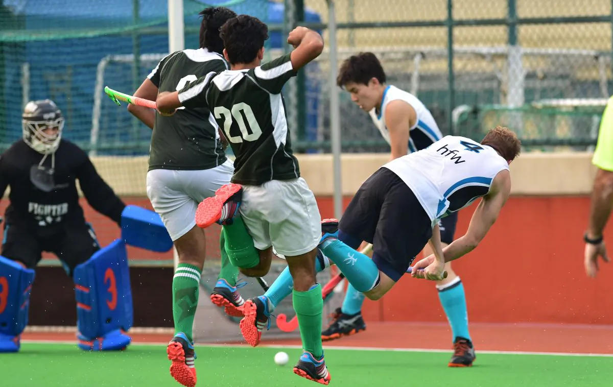 Will Glover of HKFC-A forces a way through the Pak-A defense to score goal number 3 in their 5-0 win at in the HKHA Premier Division Sports Road on Sunday Nov 29, 2015. (Bill Cox/Epoch Times)