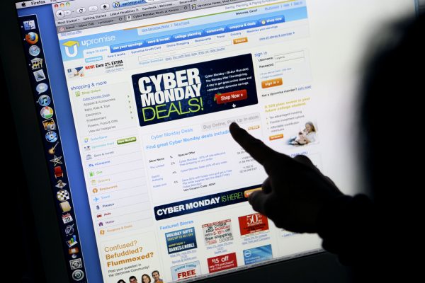 A consumer looks at Cyber Monday sales on her computer at her home in Palo Alto, Calif., on Nov. 29, 2010. Shoppers spent more than $3 billion online on Cyber Monday, Nov. 30, 2015, making it the biggest online shopping day ever. (AP Photo/Paul Sakuma)