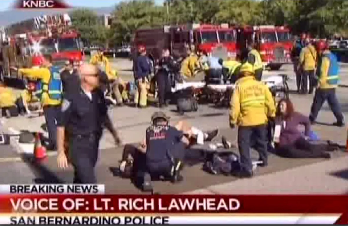 First responders attend to people outside a Southern California social services center in San Bernardino, where one or more gunmen opened fire, shooting multiple people on Wednesday, Dec. 2, 2015. (KNBC via AP)