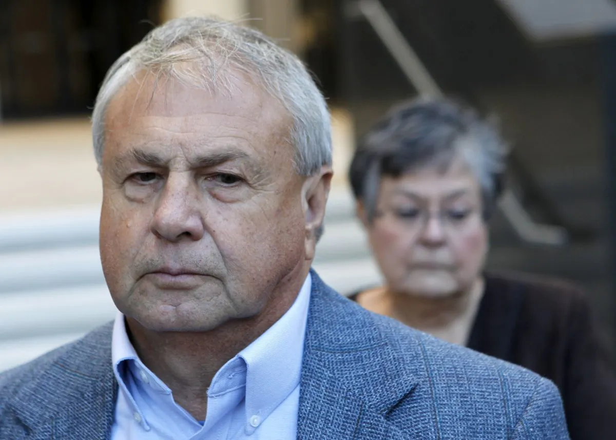 In a Wednesday, Nov. 28, 2012 file photo, Donald Vidrine, a BP well site leader from the Deepwater Horizon oil rig explosion, stands with his attorneys outside Federal Court after being arraigned on manslaughter charges in New Orleans. (AP Photo/Gerald Herbert)